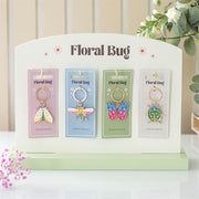 Set of 24 Floral Bug Keyrings on Display